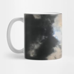 Light of hope. Horror sky. Thick grey clouds-cape with bright sun peeping out through the clouds Mug